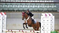 Alqaqaa Tamim bin Hamad Al Thani guides Grietje W S over a fence in the Intro 2 class event.