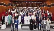 QU President Dr. Omar Al Ansari  (centre, second row) with other participants during a group photo during the opening ceremony of the IAU 2023 Conference.