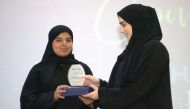 Reema Abdulaziz Al Ghali a student of Doha Academy receiving the award.