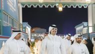 H E Sheikh Thani bin Hamad bin Khalifa Al Thani (centre) with General Manager of Cultural Village Foundation, Katara Prof. Dr. Khalid bin Ibrahim Al Sulaiti (right), and other officials during the opening of the World Arabian Horse Championship 2023 at the Old Doha Port yesterday.