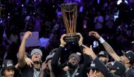 LeBron James of the Los Angeles Lakers hoists the trophy with his teammates after winning the championship game of the inaugural NBA In-Season Tournament at T-Mobile Arena on December 09, 2023 in Las Vegas, Nevada. (Photo by Ethan Miller / Getty Images via AFP)