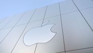 An Apple logo is seen on the outside of an Apple store as new iPhones are released for sale in San Francisco, California on September, 22, 2017. Photo by Josh Edelson / AFP