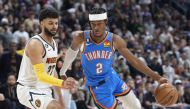 File photo: Oklahoma City Thunder guard Shai Gilgeous-Alexander, right, drives past Denver Nuggets guard Jamal Murray in the second half of an NBA basketball game Sunday, Jan. 22, 2023, in Denver. David Zalubowski / Associated Press

