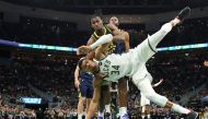 Giannis Antetokounmpo #34 of the Milwaukee Bucks is fouled by Aaron Nesmith #23 of the Indiana Pacers at Fiserv Forum on December 13, 2023 in Milwaukee, Wisconsin. Stacy Revere/Getty Images/AFP 