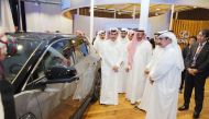 Minister of Transport H E Jassim Saif Ahmed Al Sulaiti (right) and officials touring the pavilion.