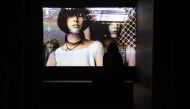 A visitor watches the video of a performance screened in the exhibition titled 'What if women ruled the world?' at the National Museum of Contemporary Art (EMST) in Athens on December 14, 2023. (Photo by Angelos Tzortzinis / AFP) 
