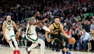 Stephen Curry #30 of the Golden State Warriors is guarded by Jaylen Brown #7 of the Boston Celtics at Chase Center on December 19, 2023 in San Francisco, California. Ezra Shaw/Getty Images/AFP 