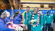 Saudi Arabia players are welcomed upon their arrival at the Hamad International Airport in Doha, yesterday.