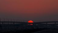 Sun sets behind two intersecting flyovers over the G Ring road near Barwa Village on the last day of 2023, December 31, 2023. Pic: Salim Matramkot / The Peninsula
