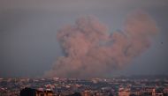 A picture taken from Rafah shows smoke billowing over Khan Yunis in the southern Gaza Strip during Israeli bombardment on January 3, 2024. Photo by AFP