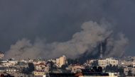 A picture taken from Rafah on January 5, 2024 shows smoke billowing over Khan Yunis in the southern Gaza Strip during Israeli bombardment. (Photo by AFP)