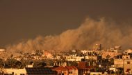 A picture taken from Rafah shows smoke billowing over Khan Yunis in the southern Gaza Strip during Israeli bombardment on January 11, 2024. 