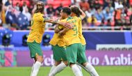 Australia's defender #05 Jordan Bos (C) celebrates with teammates after scoring his team's second goal on January 13, 2024. (Photo by Hector Retamal / AFP)
