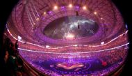 This picture taken with a fisheye lens shows lights illuminating the opening ceremony of the AFC Qatar 2023 Asian Cup before the Group A football match between Qatar and Lebanon at the Lusail Stadium in Lusail, north of Doha on January 12, 2024. (Photo by KARIM JAAFAR / AFP)