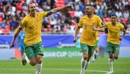 Jackson Irvine (left) celebrates with teammates after scoring Australia’s first goal against India, yesterday. AFP