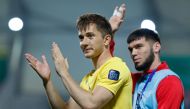 Tajikistan’s goalkeeper Rustam Yatimov salutes the fans after the end of the match against China. AFP