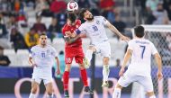 Action during Group B match between Uzbekistan and Syria at Jassim Bin Hamad Stadium yesterday.  