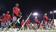 Qatar players during a training session as they prepare for their second Asian Cup Group A match against Tajikistan yesterday. 