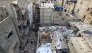 People inspect the damage following Israeli bombardment in Rafah, on the southern Gaza Strip, on January 17, 2024. (Photo by AFP)