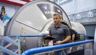 An unlocated handout picture taken on July 7, 2023 shows Turkish Astronaut Alper Gezeravci at work at the Kennedy Space Center. (Photo by Hatim Kaghat / AXIOM SPACE / AFP) 