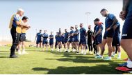 Syria coach Hector Cuper speaks to his team.