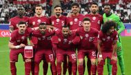 Qatar's players pose for a group photograph before the start of the Qatar 2023 AFC Asian Cup Group A football match between Tajikistan and Qatar at the Al-Bayt Stadium in Al Khor, north of Doha on January 17, 2024. (Photo by HECTOR RETAMAL / AFP)
