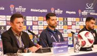 Iran coach Amir Ghalenoei (left) speaks during a press conference, yesterday.