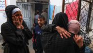 Palestinians mourn the death of loved ones following Israeli bombardment on January 18, 2024, in Rafah in the southern Gaza Strip. Photo by AFP