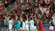 Indonesia's players wave to the fans at the end of the Qatar 2023 AFC Asian Cup Group D football match between Vietnam and Indonesia at the Abdullah bin Khalifa Stadium in Doha on January 19, 2024. (Photo by Karim Jaafar / AFP)