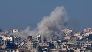 A picture taken from southern Israel on the border with the Gaza Strip shows smoke billowing over the Palestinian territory during Israeli bombardment on January 19, 2024. (Photo by JACK GUEZ / AFP)
