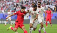 Jordan's defender #02 Mohammad Abu Hasheesh vies for the ball against South Korea's midfielder #18 Lee Kang-in during the Qatar 2023 AFC Asian Cup Group E football match between Jordan and South Korea at the Al-Thumama Stadium in Doha on January 20, 2024. (Photo by Giuseppe CACACE / AFP)