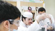 Young scientists at work in a laboratory.