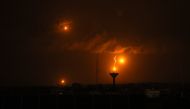 A picture taken from Rafah on January 23, 2024, shows flares fired by Israeli soldiers over Khan Yunis in the southern Gaza Strip during Israeli bombardment. Photo by AFP