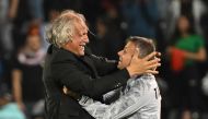 Tajikistan's Croatian coach Petar Segrt celebrates with his assistant after the Qatar 2023 AFC Asian Cup Group A football match between Tajikistan and Lebanon at the Jassim bin Hamad Stadium in Doha on January 22, 2024. (Photo by HECTOR RETAMAL / AFP)