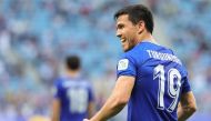 Uzbekistan's midfielder #19 Azizbek Turgunboev celebrates with teammates his team's first goal during the Qatar 2023 AFC Asian Cup Group B football match between Australia and Uzbekistan at the Al-Janoub Stadium in Al-Wakrah, south of Doha on January 23, 2024. (Photo by Giuseppe CACACE / AFP)