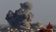 A picture taken from Rafah shows smoke billowing over Khan Yunis in the southern Gaza Strip during Israeli bombardment on January 24, 2024. (Photo by AFP)