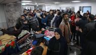 Injured people receive treatment in Gaza City's Al-Shifa hospital on January 25, 2024. (Photo by AFP)