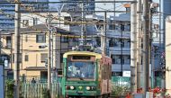 A driver guides a tram along the Toden Arakawa Line, also known as Tokyo Sakura tram, in Arakawa Ward in Tokyo on January 23, 2024. (Photo by Richard A. Brooks / AFP)