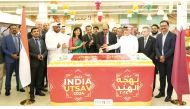 Ambassador of India to Qatar H E Vipul (fourth right) with other officials and guests cutting a cake to mark the opening of ‘India Utsav’ at Lulu Hypermarket, Al Gharafa.