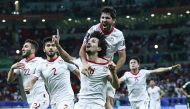 Tajikistan players celebrate.