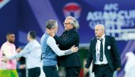 Tajikistan coach Petar Segrt (right) and UAE coach Paulo Bento after the match.