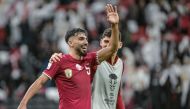 Tarek Salman (left) celebrates with a teammate.