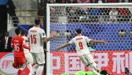 Iran’s forward Mehdi Taremi (right) celebrates team's goal against Hong Kong in the group stage.