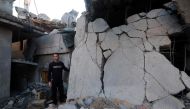 A man checks the destruction caused by Israeli bombardment in Rafah in the southern Gaza Strip on February 3, 2024. (Photo by Mohammed Abed / AFP)