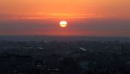 The sun rises over Rafah in the southern Gaza Strip on February 3, 2024 (Photo by SAID KHATIB / AFP)

