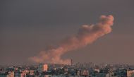  A picture taken from Rafah in the southern Gaza Strip shows smoke rising over buildings in Khan Yunis following Israeli bombardment on February 5, 2024. (Photo by Said KHATIB / AFP)
