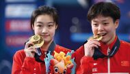 China’s Chang Yani and Chen Yiwen (women’s 3m springboard synchro diving) pose with their gold medals.