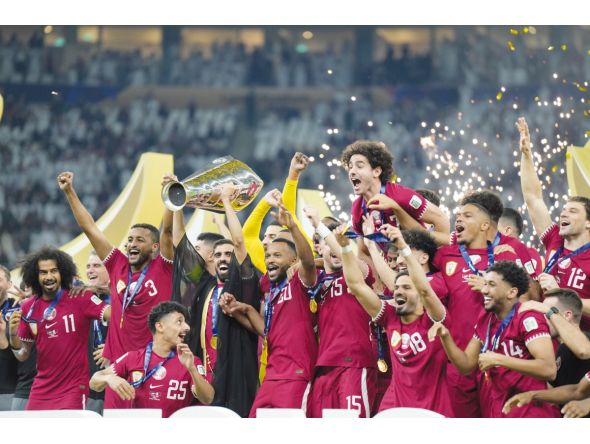 Qatar players celebrate with the trophy on Saturday night.