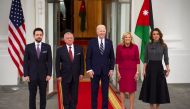 This handout picture released by the Jordanian Royal Palace shows (L-R) Jordan's Crown Prince Hussein, Jordan's King Abdullah II, US President Joe Biden, first lady Jill Biden, and Queen Rania of Jordan posing for a picture on the North Portico of the White House on February 12, 2024. (Photo by Chris Setian / Jordanian Royal Palace / AFP) 