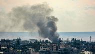 This picture shows smoke billowing following Israeli bombardments over east Rafah in the southern Gaza Strip on February 13, 2024. (Photo by SAID KHATIB / AFP)
